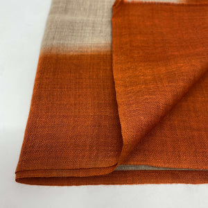 Folded edge of Camel & Titian Orange Light Weight Scarf on white background - H+E Goods Company