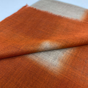 Close-up view of Camel & Titian Orange Light Weight Scarf on white background - H+E Goods Company