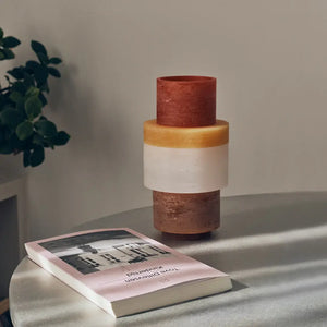 Candl Stack - Yellow on a gray table in front of a book with a plant in the background as a lifestyle image - H+E Goods Company