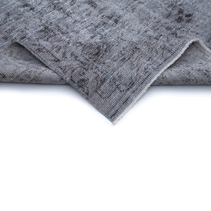 Close-up view of folded edge of Erzin Vintage Distressed Rug - H + E Goods Company