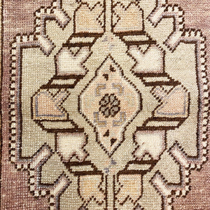 Close-up view of the main motif on Kaila Vintage Wool Rug - H+E Goods Company