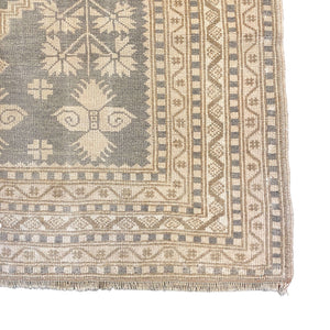 Close-up view of the edge of Lanima Distressed Vintage Rug - H + E Goods Company
