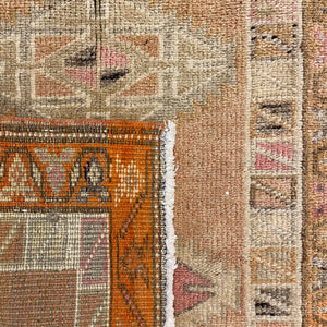 Edge of Minda Vintage Turkish Runner on it's itself as a background - H+E Goods Company