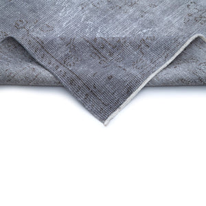 Close-up view of folded edge of Ortaca Vintage Distressed Rug
