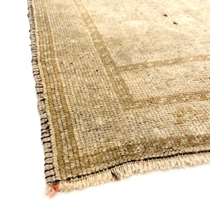 Close-up view of Pasalar Vintage Oushak Rug on white background - H+E Goods Company
