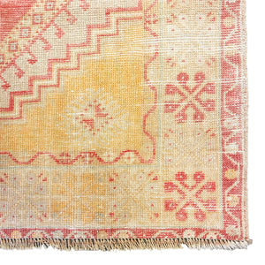 Close view of the edge of Turunc Distressed Vintage Rug - H + E Goods Company