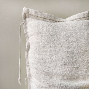 Edge of Vaeril Vintage Pillow Sack with tassles with a beige background - H+E Goods Company